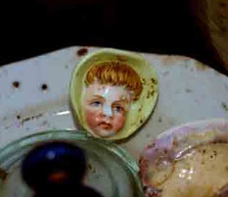 old porcelin dolly head 25 feet down in old well